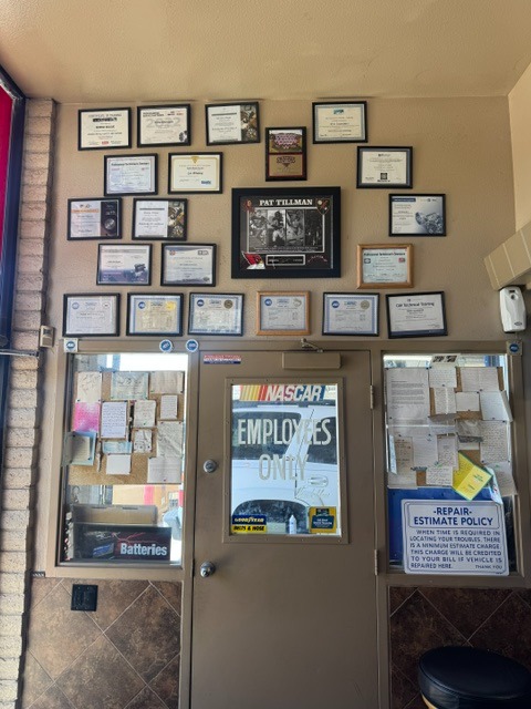 Wall of ASE and manufacturer certifications at Rob's Quality Automotive